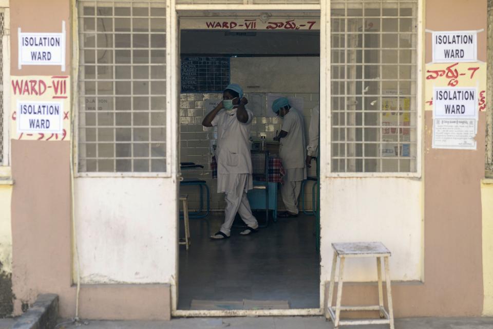 Medical nurses are seen inside an isolation ward as patients (unseen) coming from Hong Kong requested medical checks as a preventative measure following a coronavirus outbreak.