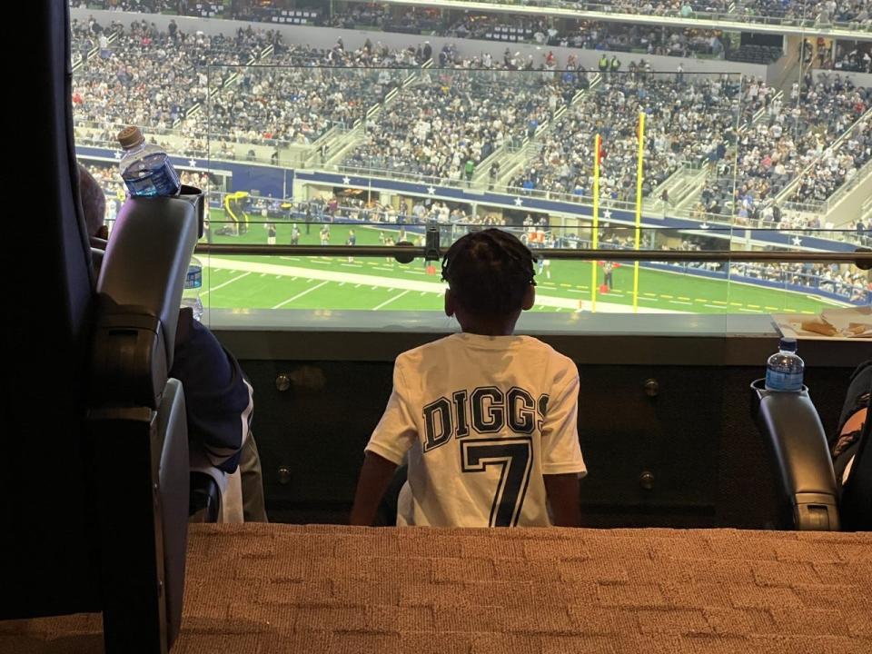 Aaiden Diggs watches his father, Cowboys cornerback Trevon Diggs, in Dallas' home game against the Washington Football Team