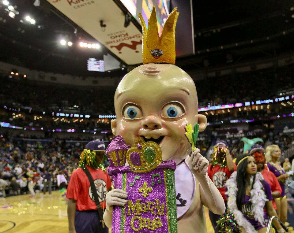 Feb 4, 2016; New Orleans, LA, USA; New Orleans Pelicans mascot for Mardi Gras the King Cake Baby walks in the Krewe of Pelicans parade at halftime of a game against the Los Angeles Lakers at the Smoothie King Center. Mandatory Credit: Derick E. Hingle-USA TODAY Sports