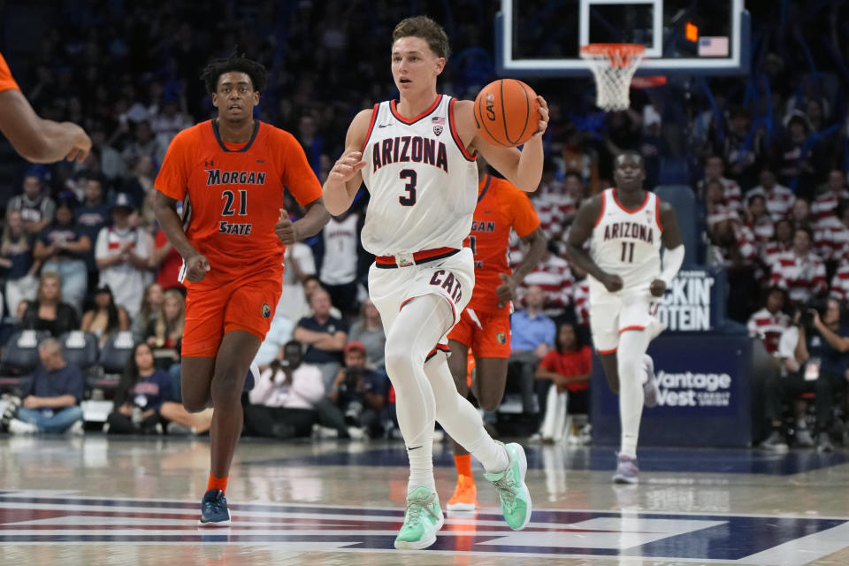 Arizona guard Pelle Larsson (3) brings the ball downcourt in front of Morgan State forward Christian Oliver (21) during the second half of an NCAA college basketball game Monday, Nov 6, 2023, in Tucson, Ariz. (AP Photo/Rick Scuteri)