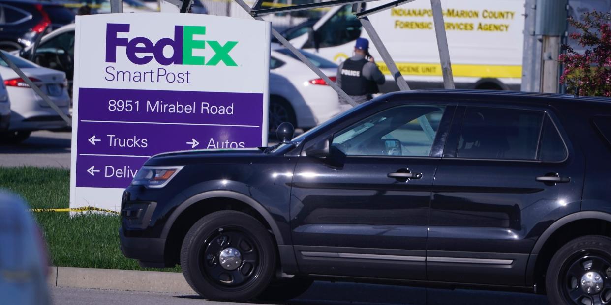 Vehicles are parked at the scene where multiple people were shot at the FedEx Ground facility early Friday morning, April 16, 2021, in Indianapolis.