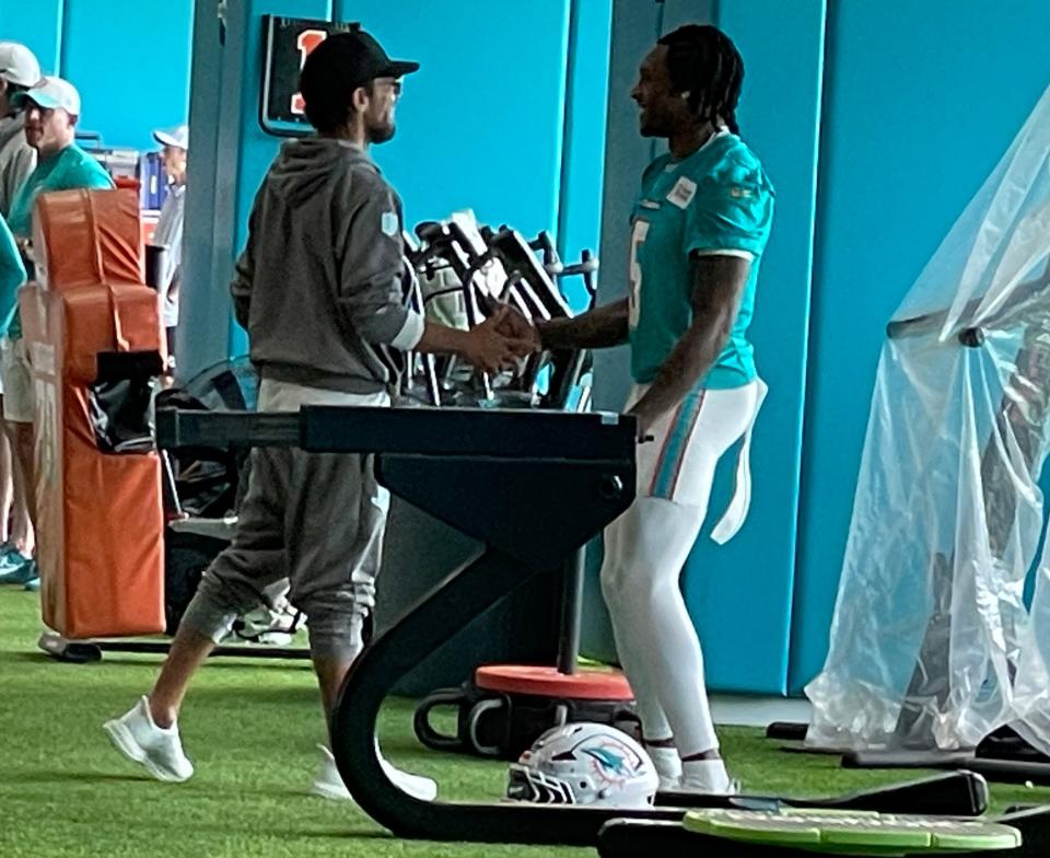 Miami Dolphins coach Mike McDaniel greets cornerback Jalen Ramsey at practice Friday, Sept. 6, 2024.