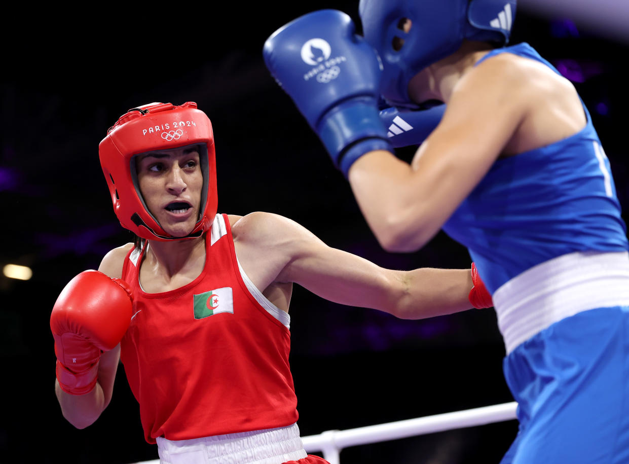 PARIS, FRANCE - AUGUST 01: Imane Khelif of Team Algeria punches Angela Carini of Team Italy during the Women's. 66kg preliminary round match on day six of the Olympic Games Paris 2024 at North Paris Arena on August 01, 2024 in Paris, France. (Photo by Richard Pelham/Getty Images)