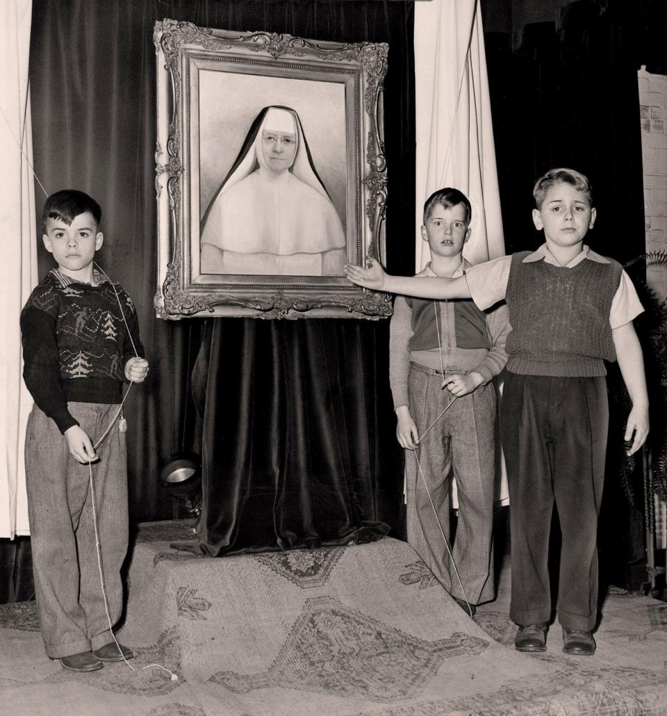 In 1947, Our Lady of the Elms pupils unveil Sister Matilda’s portrait of Mother Mary Clarissa, leader of the Dominican order. The students are (from left) James Ferraro, 7, Tyler Marshall, 8, and David Meeker, 8, who gave the dedication speech.