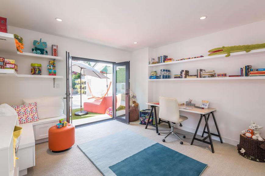 The light-filled residence has white walls and reclaimed wood floors throughout.