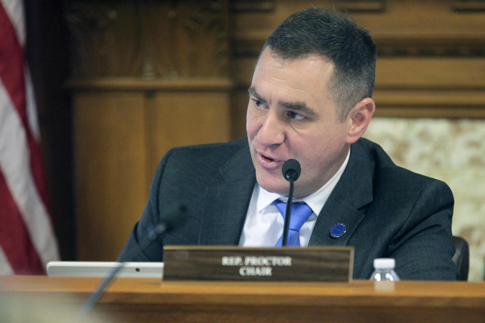 Kansas state Rep. Pat Proctor, R-Leavenworth, makes a point as chair of the House Elections Committee about a bill that would overhaul the state Governmental Ethics Commission and rewrite campaign finance laws, Tuesday, Feb. 21, 2023, at the Statehouse in Topeka, Kan. Proctor says the changes are designed to provide "more safeguards and guard rails" to ensure that the commission treats the people it investigates fairly. (AP Photo/John Hanna)