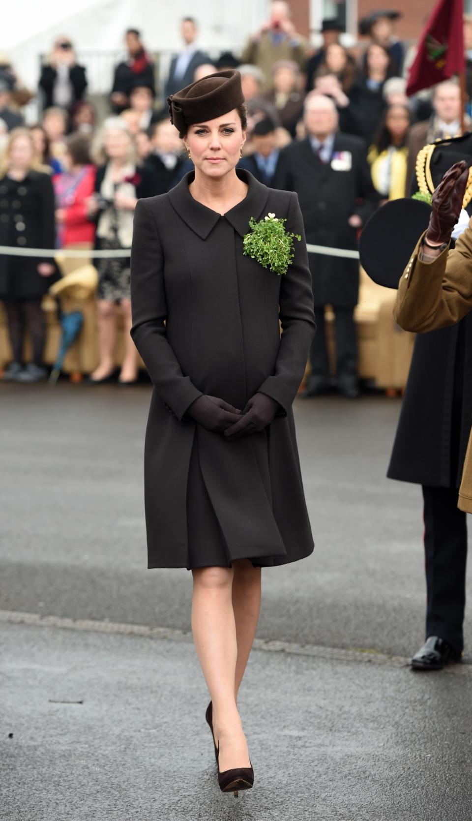 <p>In 2015, Kate was heavily pregnant with Princess Charlotte. Wearing her hair up in a neat chignon, she donned a brown Lock & Co hat (the same exact style she wore in 2012), a brown Catherine Walker coat and matching shoes by Emmy London. (Photo: PA) </p>