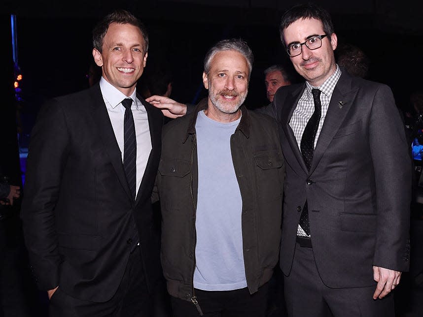 From left to right: Seth Meyers, Jon Stewart, and John Oliver.