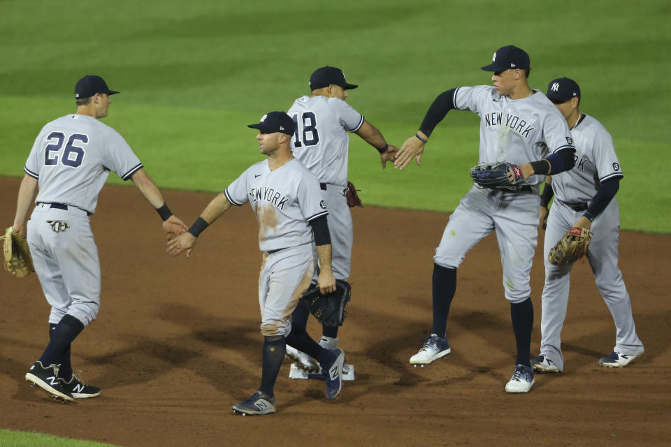 New York Yankees celebrate an 8-4 win over the Toronto Blue Jays in a baseball game Thursday, June 17, 2021, in Buffalo, N.Y. (AP Photo/Jeffrey T. Barnes)