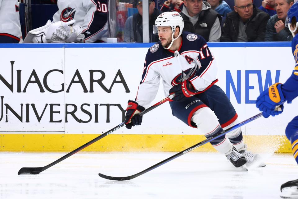 Columbus Blue Jackets right wing Justin Danforth (17) controls the puck during the second period of the team's NHL hockey game against the Buffalo Sabres on Saturday, Dec. 30, 2023, in Buffalo, N.Y. (AP Photo/Jeffrey T. Barnes)