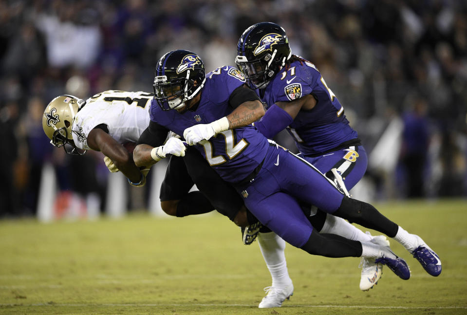 <p>Baltimore Ravens defensive back Jimmy Smith (22) and linebacker C.J. Mosley, right, tackle New Orleans Saints wide receiver Michael Thomas, left, in the second half of an NFL football game, Sunday, Oct. 21, 2018, in Baltimore. (AP Photo/Nick Wass) </p>