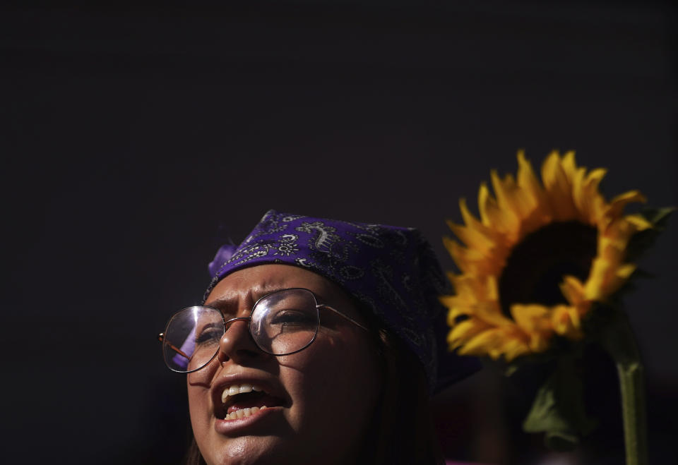 A woman shouts as feminist groups march to protest the murder of Ariadna Lopez, in Mexico City, Monday, Nov. 7, 2022. Prosecutors said Sunday an autopsy on Lopez who was found dead in the neighboring state of Morelos, showed she was killed by blunt force trauma. That contradicts a Morelos state forensic exam that suggested the woman choked on her own vomit as a result of intoxication. (AP Photo/Marco Ugarte)