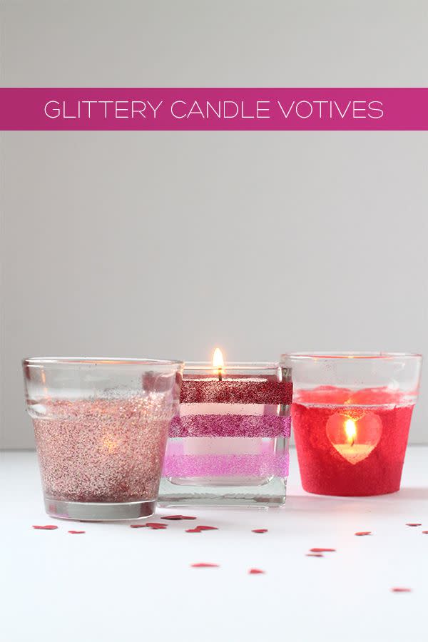 <p>Turn any small glass vessels you may have on hand into festive table decor for your romantic dinner. Go simple with glue and glitter, or try something a little more intricate by placing stickers or washi tape down before applying the sparkles. </p><p>Get the tutorial at <a href="http://squirrellyminds.com/2015/02/04/diyholiday-glittery-candle-votives-for-valentines-day/" rel="nofollow noopener" target="_blank" data-ylk="slk:Squirrelly Minds;elm:context_link;itc:0;sec:content-canvas" class="link ">Squirrelly Minds</a>.</p><p><a class="link " href="https://www.amazon.com/Pacon-Spectra-Sparkling-Crystals-91640/dp/B000J07O0A/?tag=syn-yahoo-20&ascsubtag=%5Bartid%7C10072.g.34866812%5Bsrc%7Cyahoo-us" rel="nofollow noopener" target="_blank" data-ylk="slk:SHOP GLITTER;elm:context_link;itc:0;sec:content-canvas">SHOP GLITTER</a> </p>