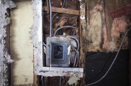 An electrical panel is pictured inside what is left of Nicole Chati's house after Superstorm Sandy in the Staten Island borough of New York, September 20, 2013. REUTERS/Carlo Allegri