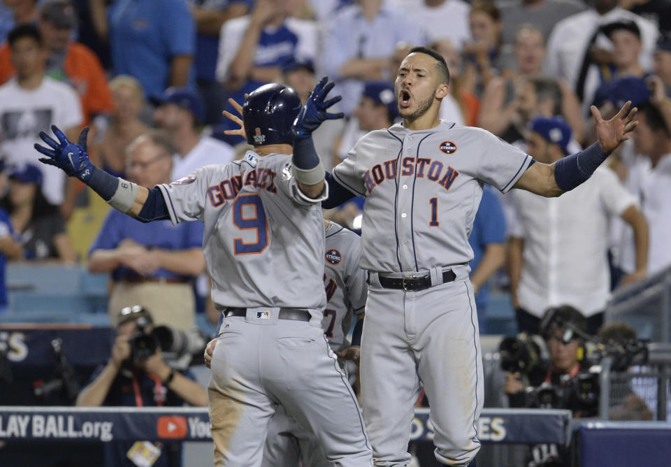 <p>Houston Astros left fielder Marwin Gonzalez (9) celebrates with shortstop Carlos Correa (1) after hitting a solo home run in the 9th inning against the Los Angeles Dodgers in game two of the 2017 World Series at Dodger Stadium. Mandatory Credit: Gary A. Vasquez-USA TODAY Sports </p>