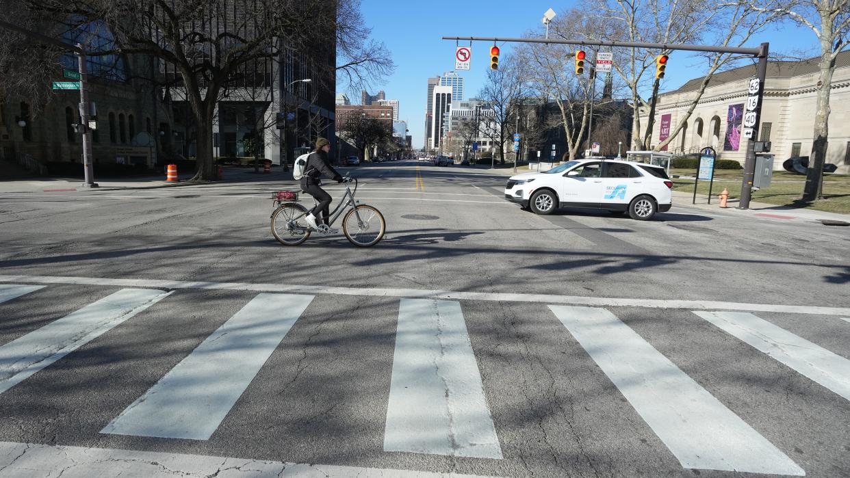 A bicyclist on Wednesday morning negotiates crossing East Broad Street at Washington Avenue in Columbus.