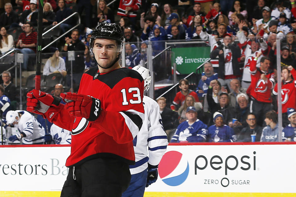 NEWARK, NJ - DECEMBER 27: Nico Hischier #13 of the New Jersey Devils reacts after scoring a goal against and the Toronto Maple Leafs during the game at the Prudential Center on December 27, 2019 in Newark, New Jersey. (Photo by Andy Marlin/NHLI via Getty Images)