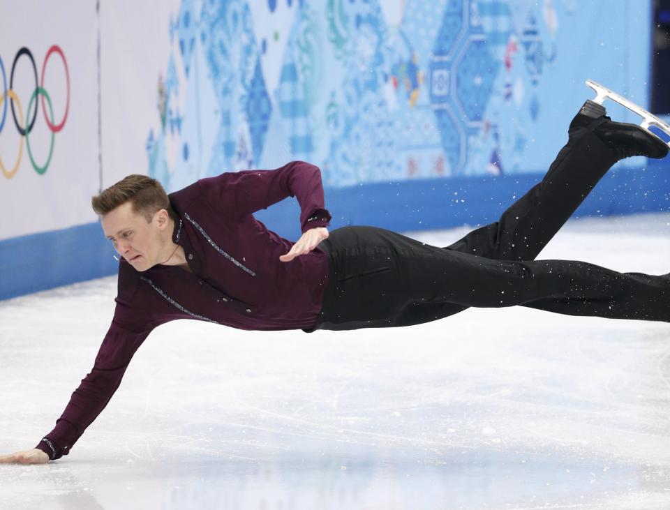Jeremy Abbott of the U.S. falls on the ice during the Figure Skating Men's Short Program at the Sochi 2014 Winter Olympics