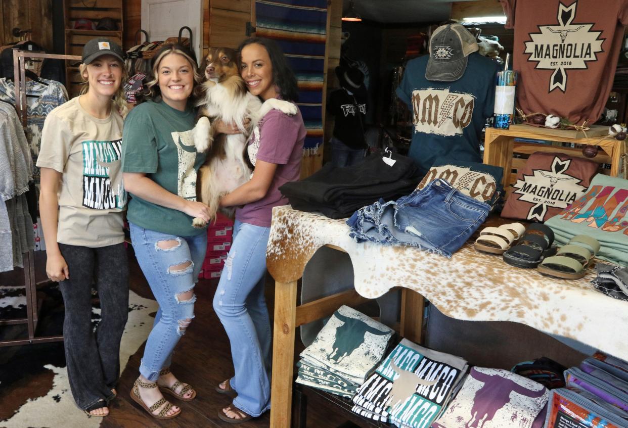 Bailee Jones, Summer Barnes and Keelee Jones with “Benny” inside Magnolia Mill Ladies Boutique on Main Street in Boiling Springs Friday afternoon, April 29, 2022.