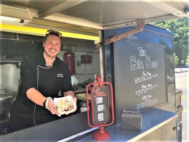 The Big Bad Food Truck is run by chef Ben St. Jeanne, pictured in the truck, and his wife Molly.