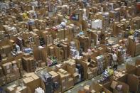 Workers collect customer orders during Black Friday deals week at an Amazon fulfilment centre in Hemel Hempstead, Britain November 25, 2015. REUTERS/Neil Hall