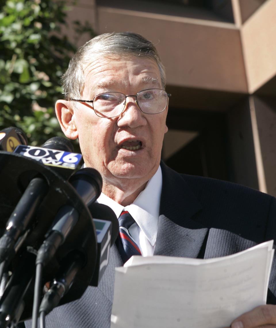 Republican Congressman Randy "Duke" Cunningham, of the 50th district in California, reads a statement outside the federal courthouse in San Diego on Nov. 28, 2005, where he pled guilty to conspiring to commit bribery, honest services fraud, and tax evasion.