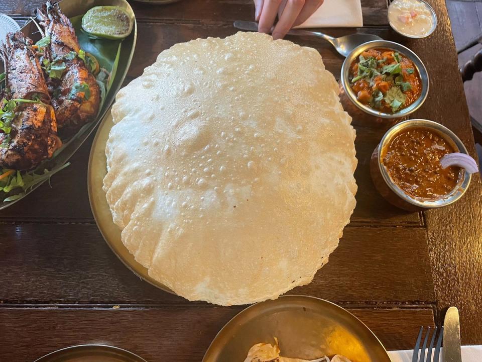 Thhe channa bhatura, a type of puffed up fried bread (Kate Ng)