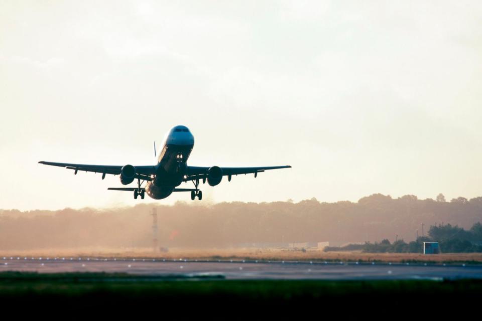 PHOTO: Stock photo of a plane landing on the runway of an airport. (Greg Bajor/Getty Images)