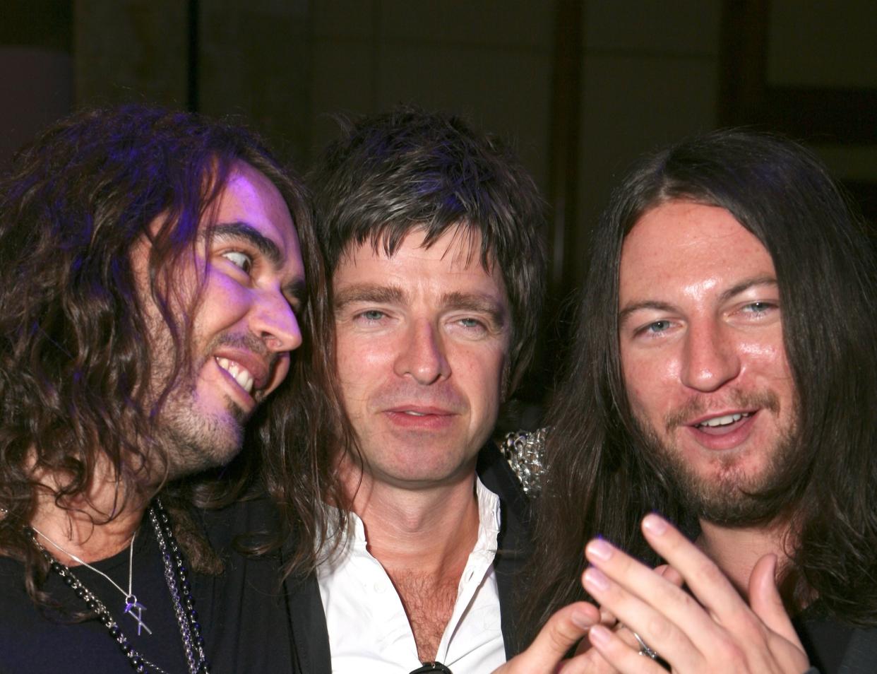 Russell Brand, left, and Matt Morgan, right, pictured with Noel Gallagher in 2008. (Getty Images)