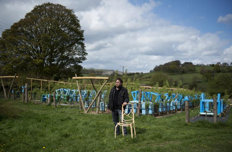 Gavin Munro stands with an early prototype chair at his plantation