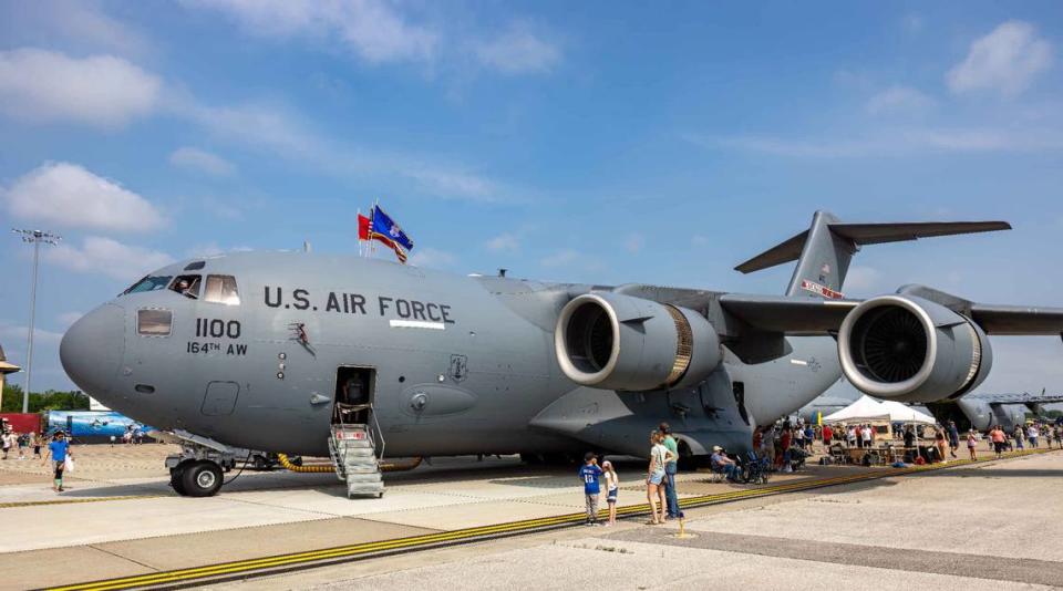 A large line waits to board a C-17 Globemaster III during the Scott Air Force Base Airshow on Saturday. The airshow, at SAFB for the first time since 2017, drew large crowds.