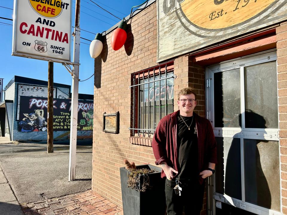 Travis Roberts stands in front of The Golden Light and next door, Golden Light Cantina in Amarillo, where Roberts is a frequent performer, playing to sold out crowds.