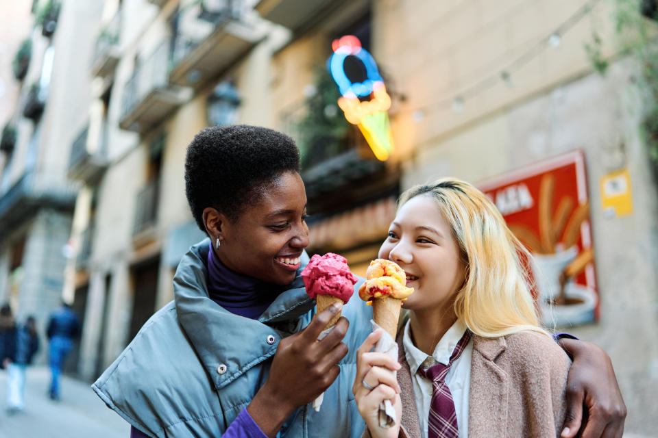 A couple is eating ice cream