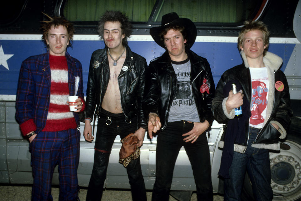 UNITED STATES - JANUARY 01:  USA  Photo of Steve JONES and SEX PISTOLS and Johnny ROTTEN and Sid VICIOUS, Johnny Rotten (John Lydon), Sid Vicious, Steve Jones & Paul Cook, posed, group shot, next to the tourbus, on final tour  (Photo by Richard E. Aaron/Redferns)