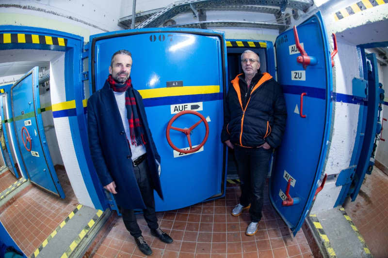 Heinz Fuhrmann (r), owner of a bunker in Pasewalk, a German town near the Polish border, and Dieter Schult (l), real estate agent, stand in an underground bunker. According Fuhrmann, there are several interested parties for the bunker for sale. Stefan Sauer/dpa