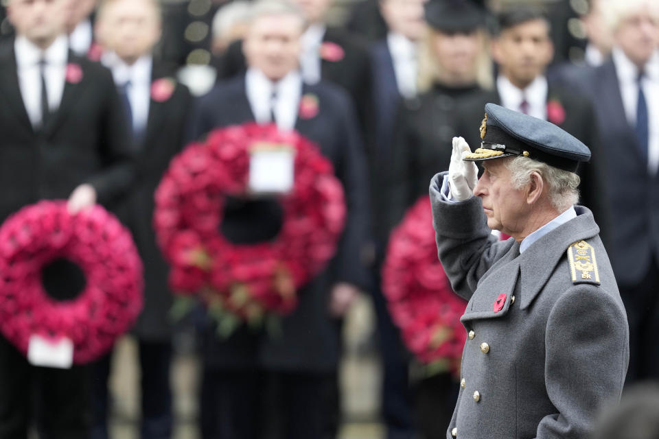 FILE - Britain's King Charles III salutes as he attends the Remembrance Sunday ceremony at the Cenotaph on Whitehall in London, Sunday, Nov. 12, 2023. As head of state the king also hosts world leaders visiting the U.K., and serves as a symbol of national identity, unity and continuity. Every year the monarch leads Remembrance Day ceremonies to honor the war dead, and many watch his annual Christmas Day broadcast. (AP Photo/Kin Cheung, Pool, File)