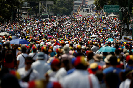 Supporters of Venezuelan opposition leader Juan Guaido, who many nations have recognized as the country's rightful interim ruler, take part in a rally against Venezuelan President Nicolas Maduro's government in Caracas, Venezuela, April 6, 2019. REUTERS/Carlos Garcia Rawlins