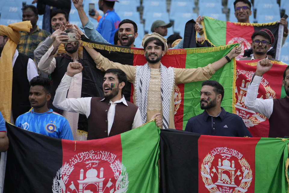 Afghanistan supporters cheer during the ICC Men's Cricket World Cup match between Afghanistan and Netherlands in Lucknow, India, Friday, Nov. 3, 2023. (AP Photo/Altaf Qadri)