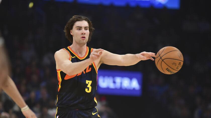 Oklahoma City Thunder guard Josh Giddey pushes down the court