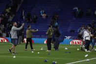 Supporters run in the file after the Spanish La Liga soccer match between Espanyol and Barcelona at the RCDE stadium in Barcelona, Sunday, May 14, 2023. (AP Photo/Joan Monfort)