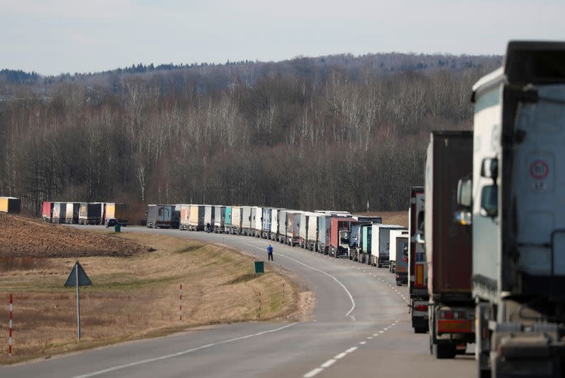 FILE PHOTO: Trucks queue to enter a crossing point at the border between Belarus and Lithuania near Muravevka