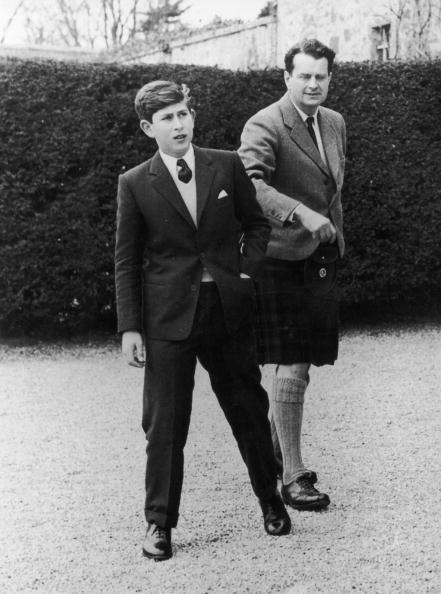 <p>Prince Charles arrives at Gordonstoun School in Scotland for his first term. Here, he's with Captain Iain Tennant, chairman of the board of governors.</p>