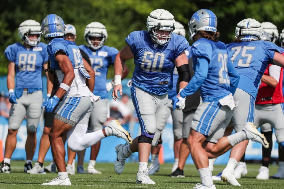 Detroit Lions guard Graham Glasgow runs a drill during the joint practice with New York Giants at Detroit Lions headquarters and training facility in Allen Park on Wednesday, August 9, 2023.