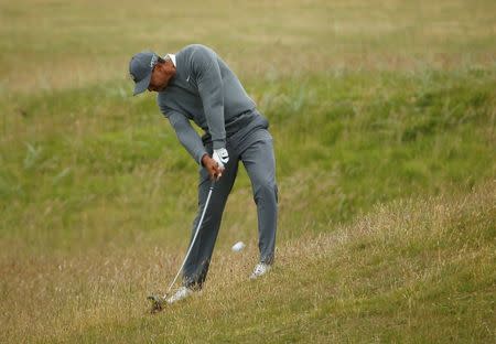 Tiger Woods of the U.S. plays his second shot on the fifth hole during the first round of the British Open golf championship on the Old Course in St. Andrews, Scotland, July 16, 2015. REUTERS/Lee Smith . Picture Supplied by Action Images