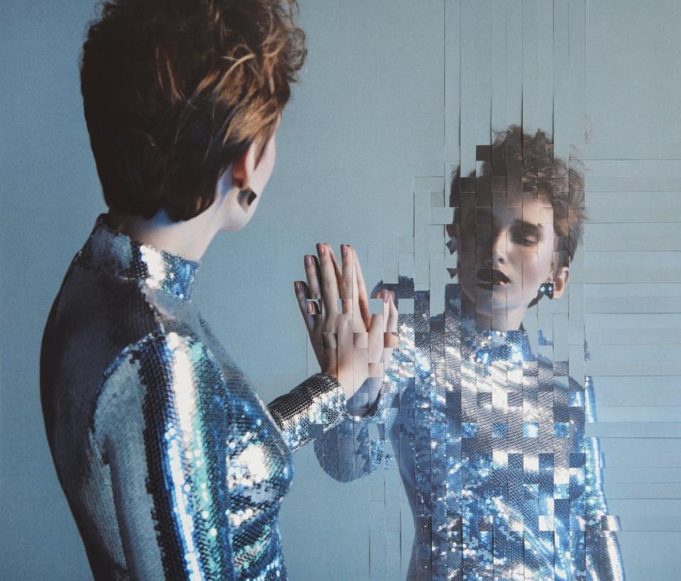 <span class="caption">A digital twin attempts to capture every aspect of a real thing, including up-to-the-moment changes.</span> <span class="attribution"><a class="link " href="https://www.gettyimages.com/detail/photo/analog-collage-with-female-portrait-and-her-mirror-royalty-free-image/1309294833" rel="nofollow noopener" target="_blank" data-ylk="slk:lambada/E+ via Getty Images;elm:context_link;itc:0;sec:content-canvas">lambada/E+ via Getty Images</a></span>