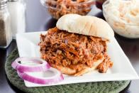 <p><strong>Pulled Pork Sandwich</strong></p><p>At <a href="http://currituckbbq.com/" rel="nofollow noopener" target="_blank" data-ylk="slk:Currituck BBQ Company;elm:context_link;itc:0;sec:content-canvas" class="link ">Currituck BBQ Company</a>, there’s nothing like slow-cooked pork that falls off the bone to make the perfect barbecue sandwich. True barbecue to put us in a food coma. Unlike sweet, North Carolina is known for the sauce being vinegar and pepper-based. </p>