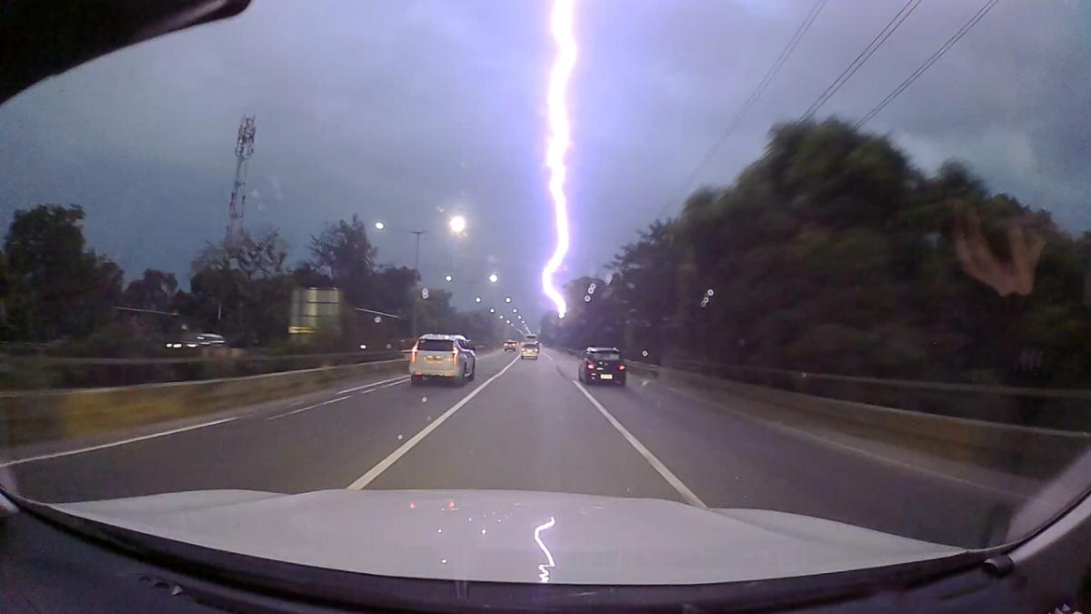 Spectacular lightning bolt lights up the skies over highway