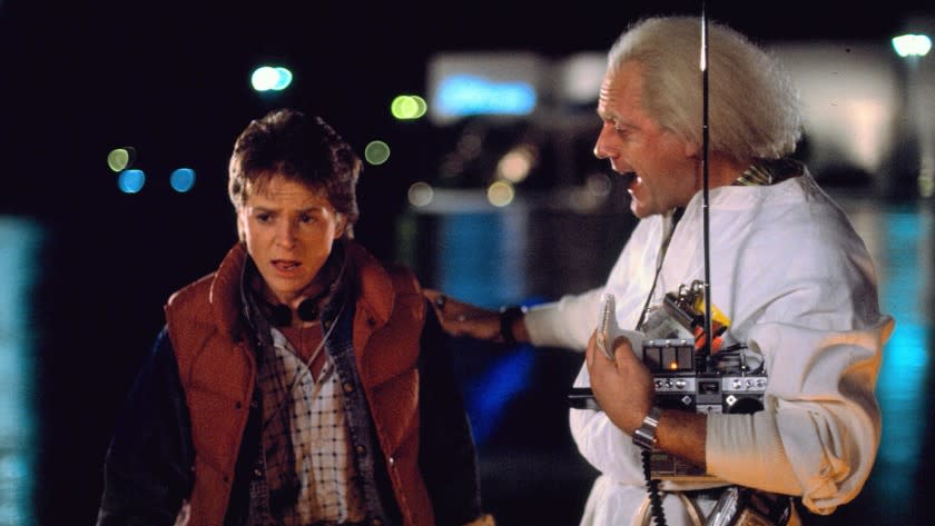 Michael J. Fox and Christopher Lloyd in the 1985 movie BACK TO THE FUTURE. Cr: Universal.