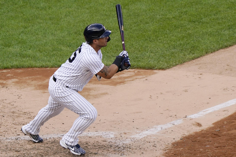 New York Yankees pinch hitter Gleyber Torres follows through on a two-run double to center field in the eighth inning of a baseball game against the Baltimore Orioles, Sunday, Sept. 13, 2020, at Yankee Stadium in New York. (AP Photo/Kathy Willens)