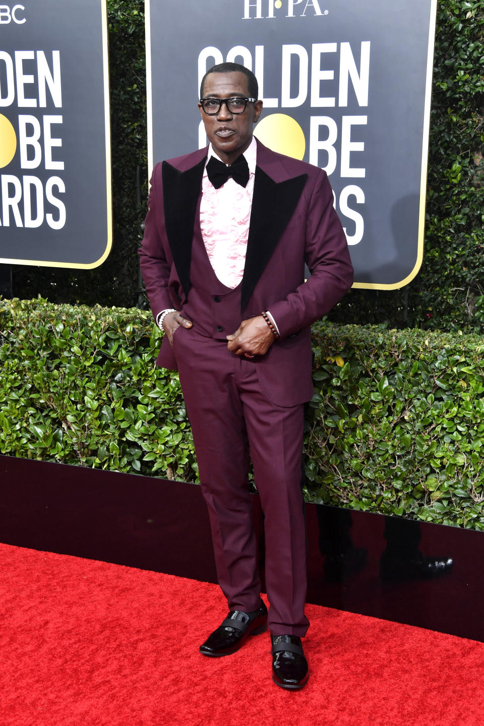 Wearing a maroon suit. <em>[Photo: Getty]</em>